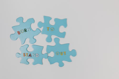 Free Jigsaw Tabs with Text on the Surface Stock Photo