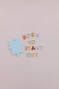 Cutout Letters Beside a Piece of Puzzle