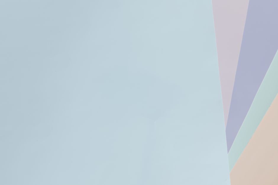 Minimalist pastel abstract background with light blue, purple, and beige shades.