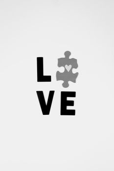 Black and white love puzzle piece image symbolizing unity and connection.