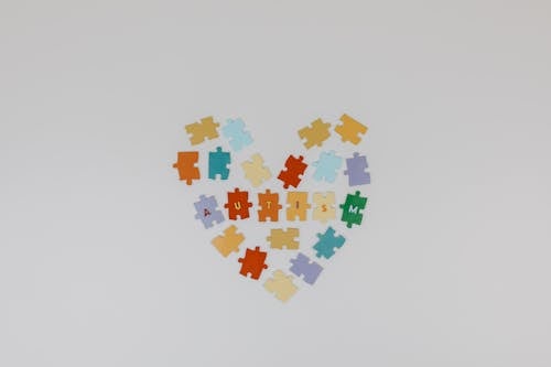 Free Colorful Puzzle Pieces with Letters Stock Photo