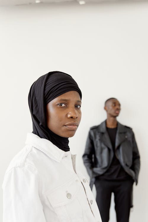 A Woman in Black Hijab and White Jacket