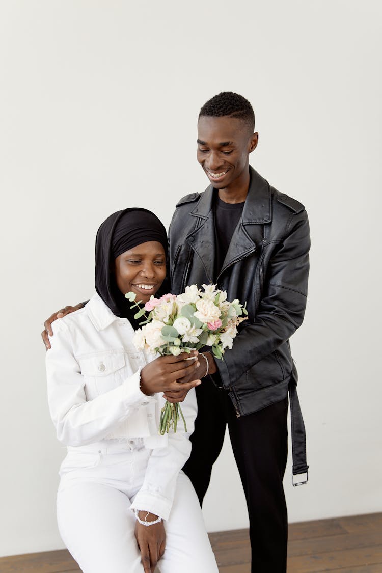 Man Giving Woman Flowers