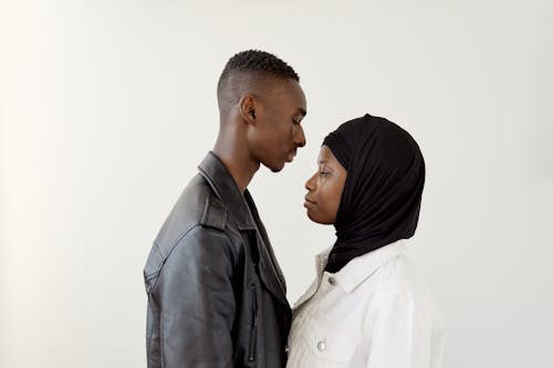 Side View of a Couple with a White Background