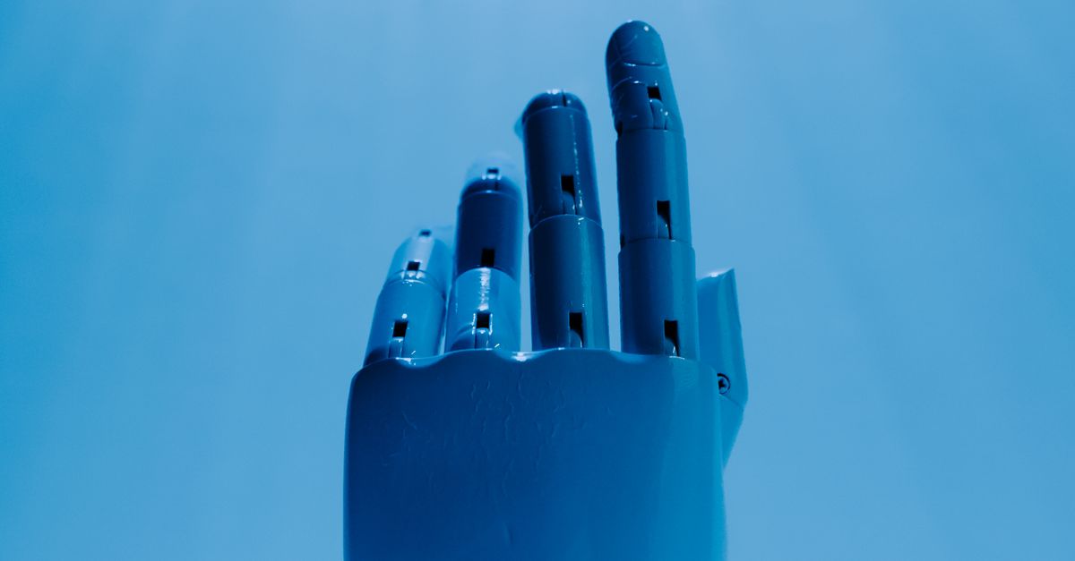 Photo by Tara Winstead A robotic hand reaching out against a radiant blue sky, symbolizing futuristic technology.