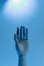 Robot Hand on Blue Background
