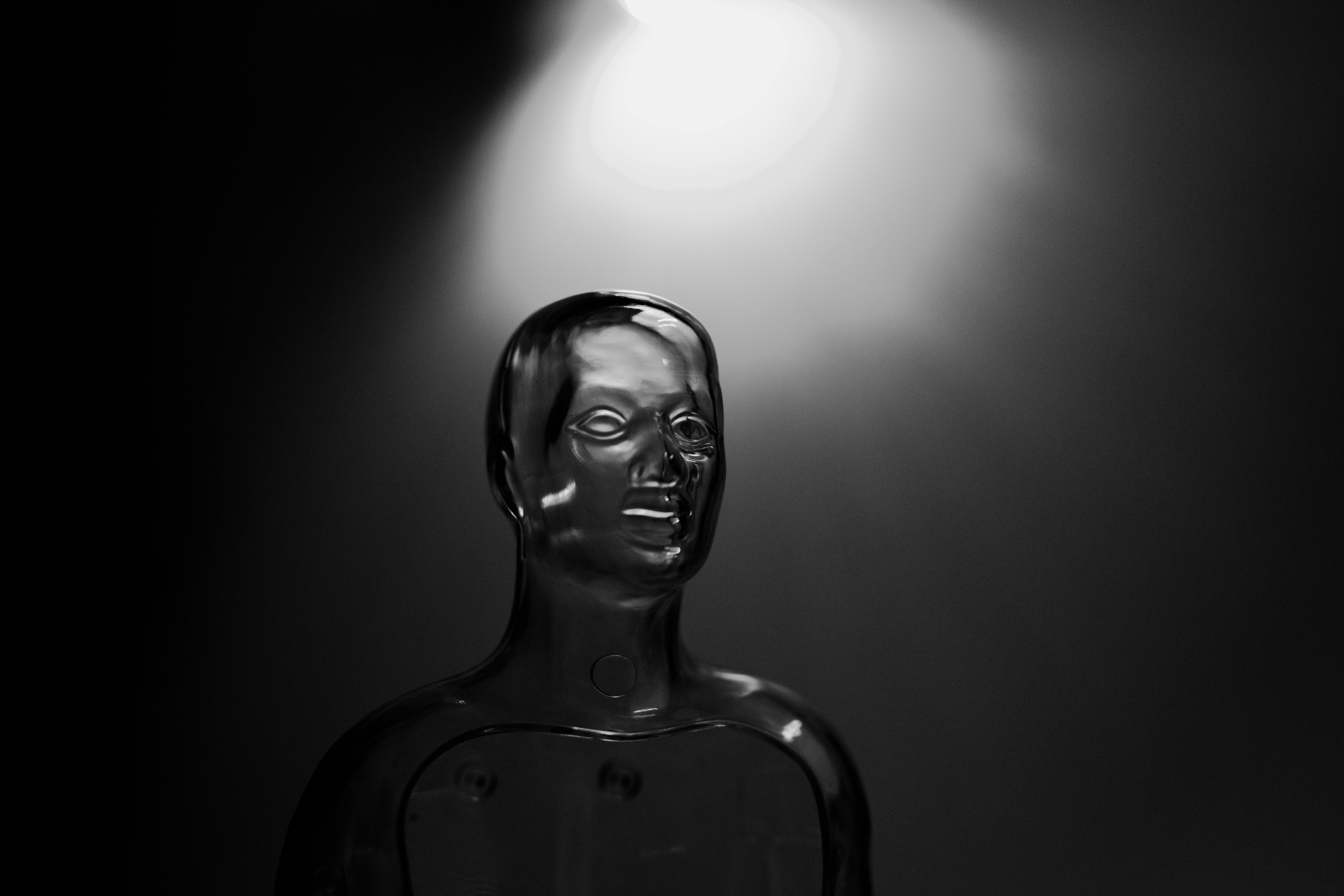 black and white photo of a transparent mannequin