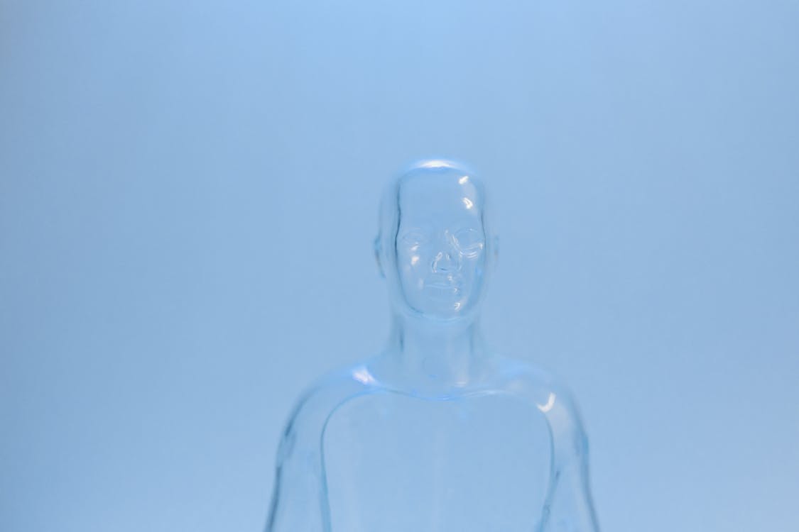 Plastic Mannequin on Blue Background