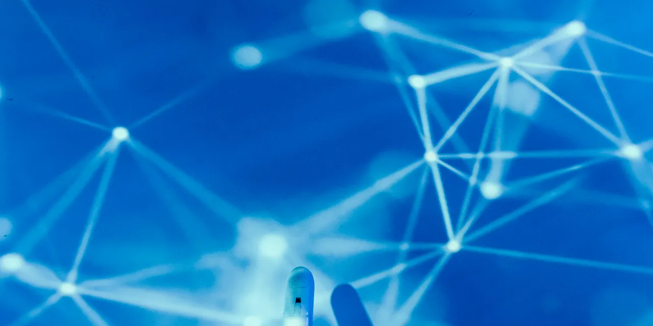A robotic hand reaching toward a glowing digital network, representing AI search visibility and getting your brand noticed by AI