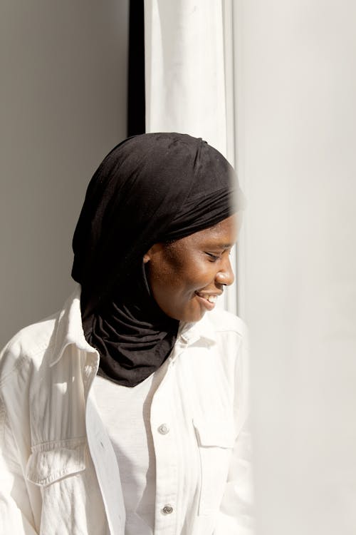 Woman Wearing a Black Hijab Looking Down