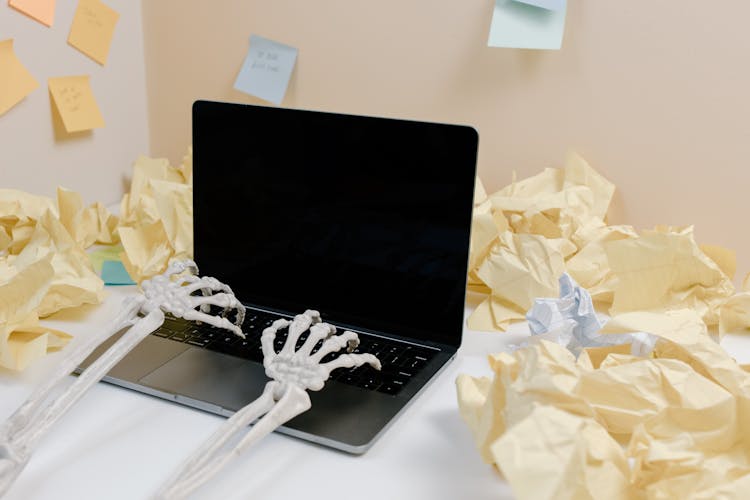 Skeleton Hands Typing In Laptop 