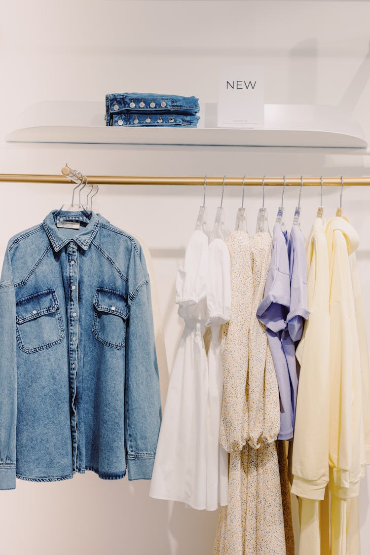 Blue Denim Jacket Hanging On A Clothes Rack