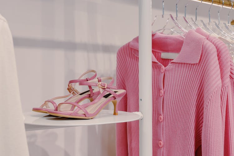 Pink Sandals Beside A Pink Cardigan 