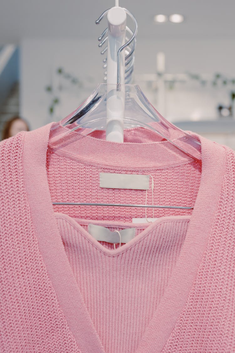 Pink V Neck Shirt On White Plastic Clothes Hanger