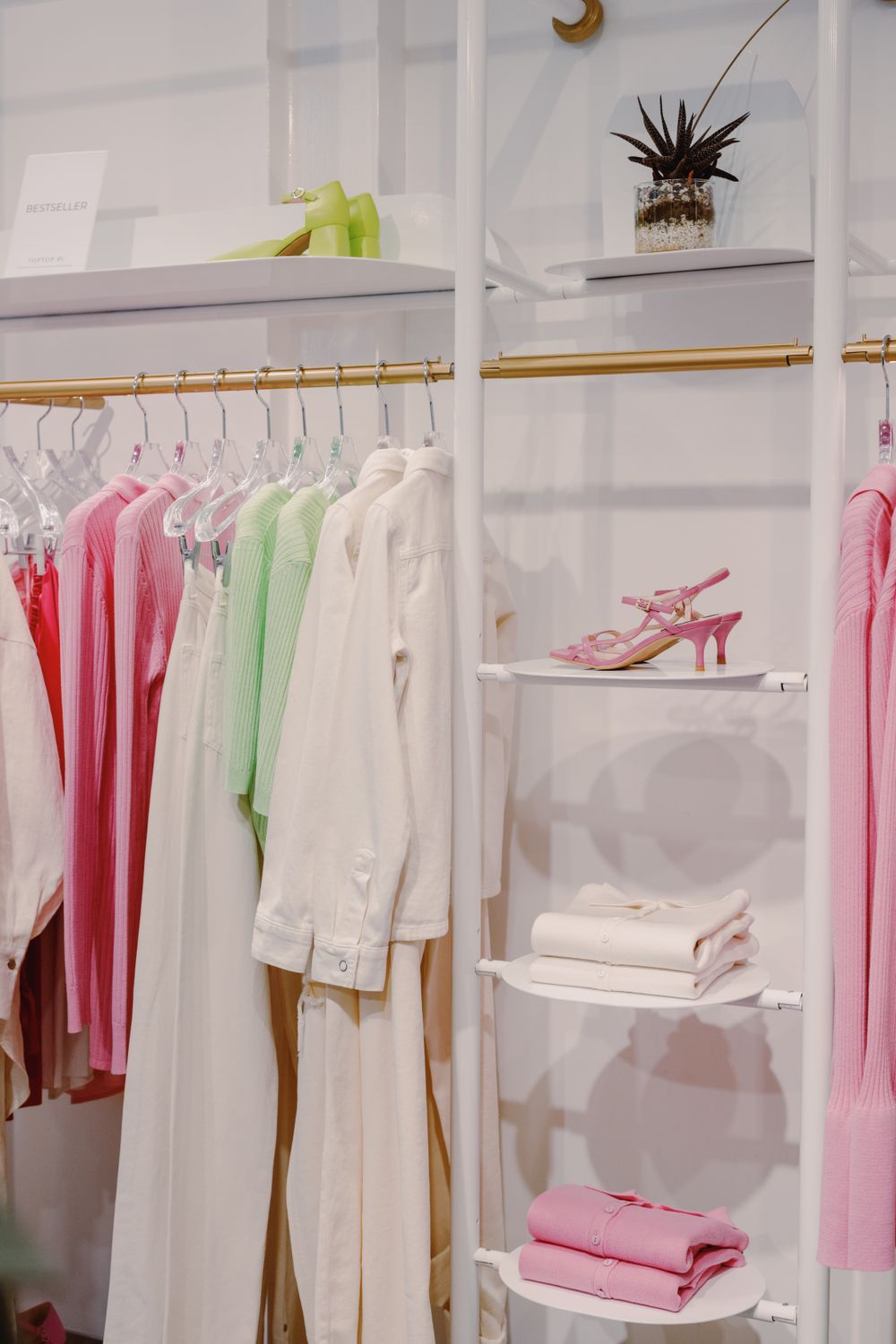 Garments stored with space to breathe on a boutique rack