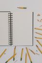 White Spiral Notebook With Yellow Pencils