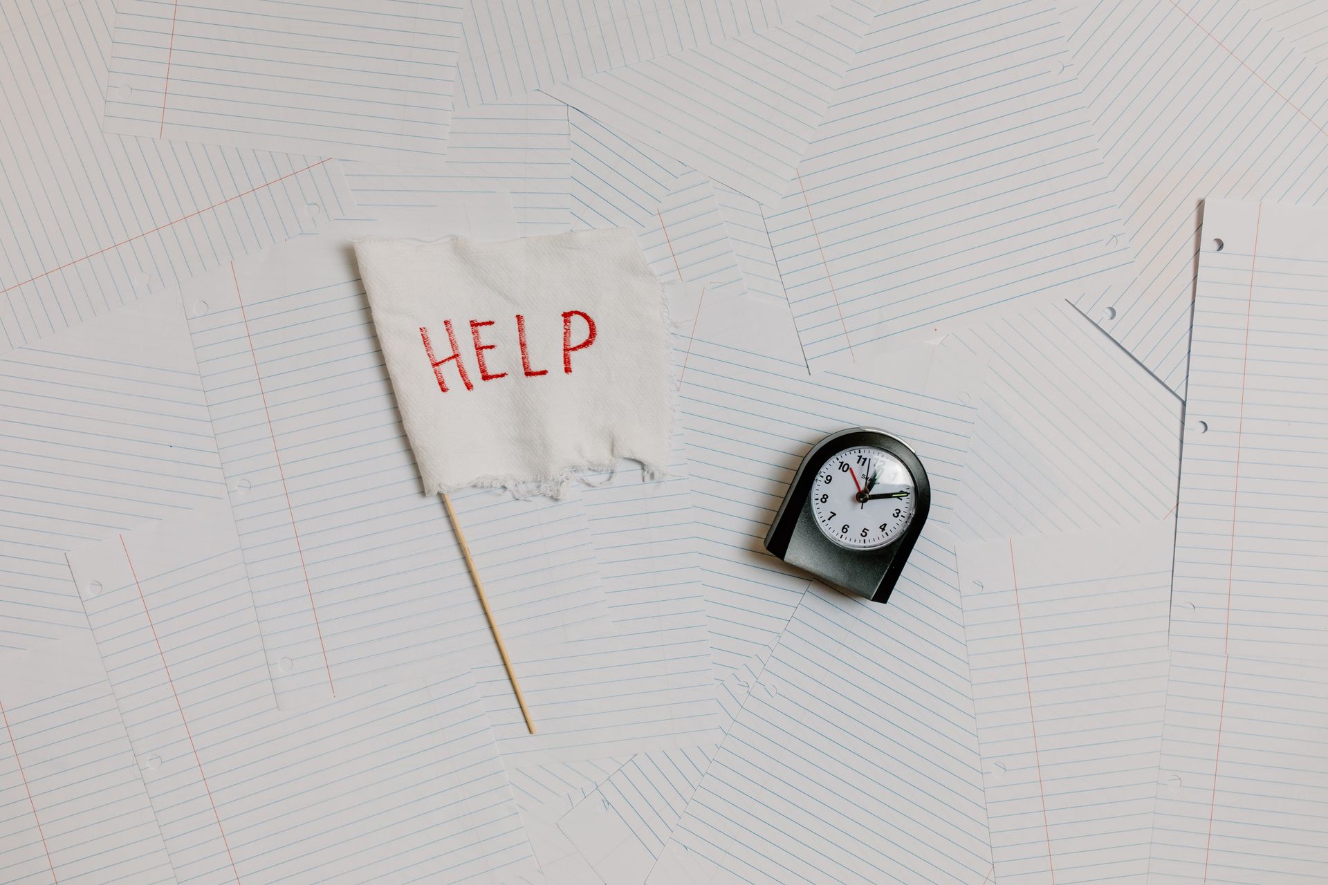 Black and White Clock on White Papers
