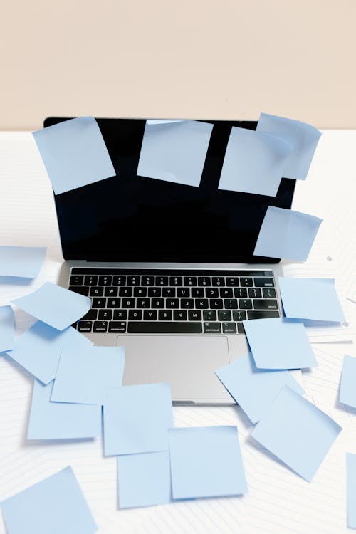 Free Black and Silver Laptop with Blue Sticky Notes Stock Photo