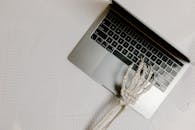 Macbook Pro on White Table