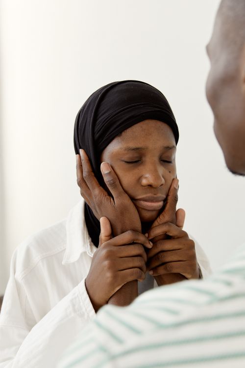 Free A heartfelt moment as a Muslim couple shares a tender embrace, symbolizing love and support. Stock Photo