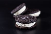 Cocoa sandwich cookies with cream filling — photo by Terrance Barksdale on Pexels