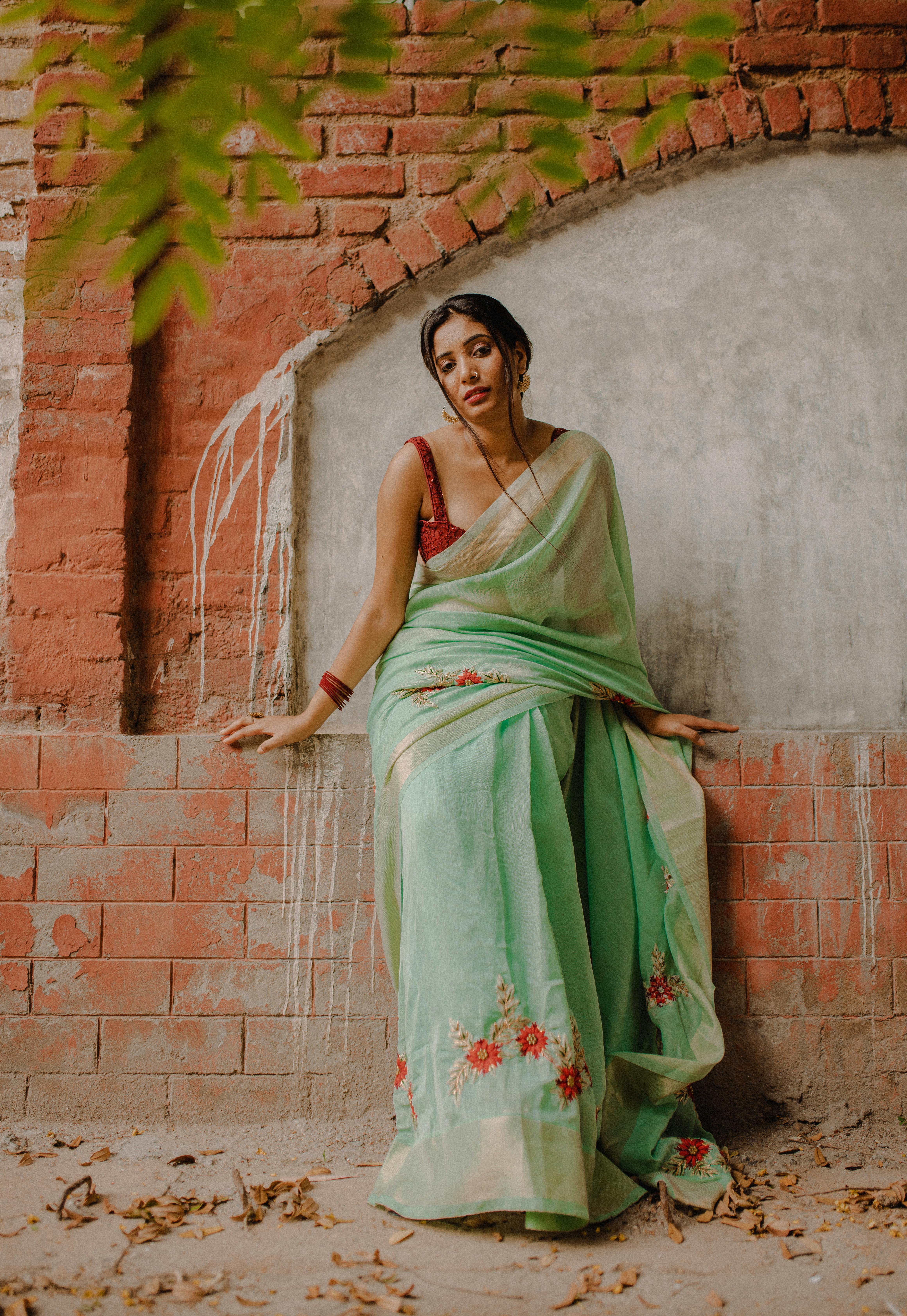 Image of Indian traditional Beautiful Woman Wearing an traditional Saree  And Posing On The Outdoor With a Smile Face-QP185219-Picxy