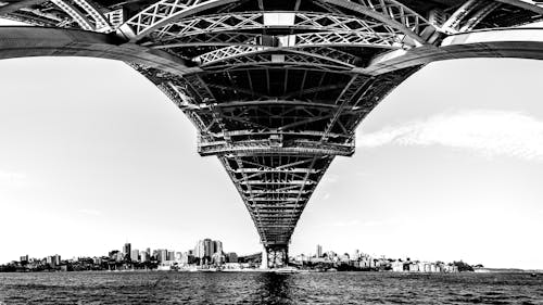 Free Grayscale Photo of Bridge over Body of Water Stock Photo