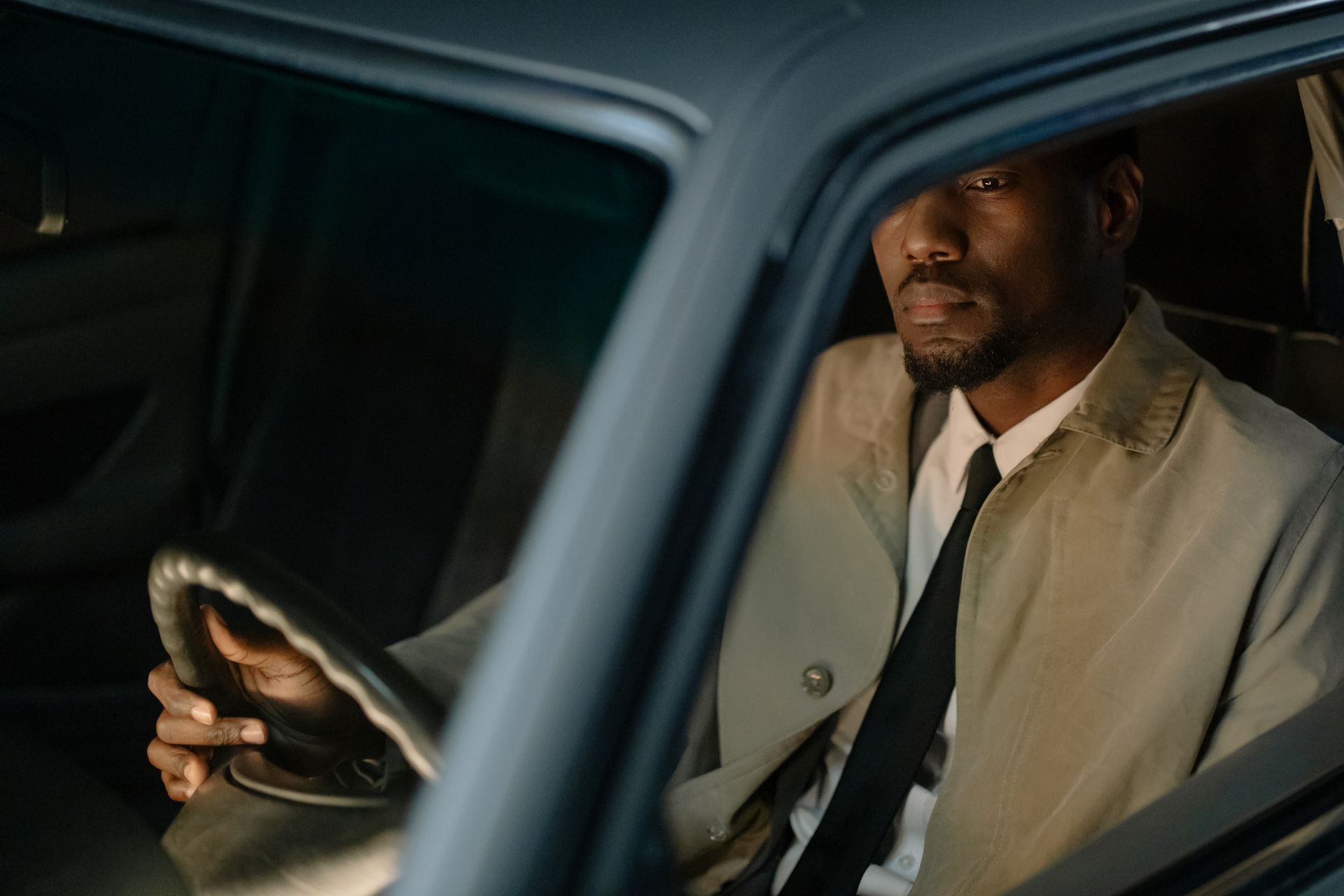 Man Sitting Inside a Car and Waiting