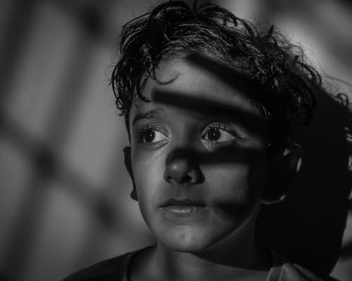 Grayscale Photo of a Boy's Face