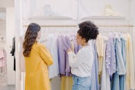 A Woman Looking at Clothes with a Personal Stylist