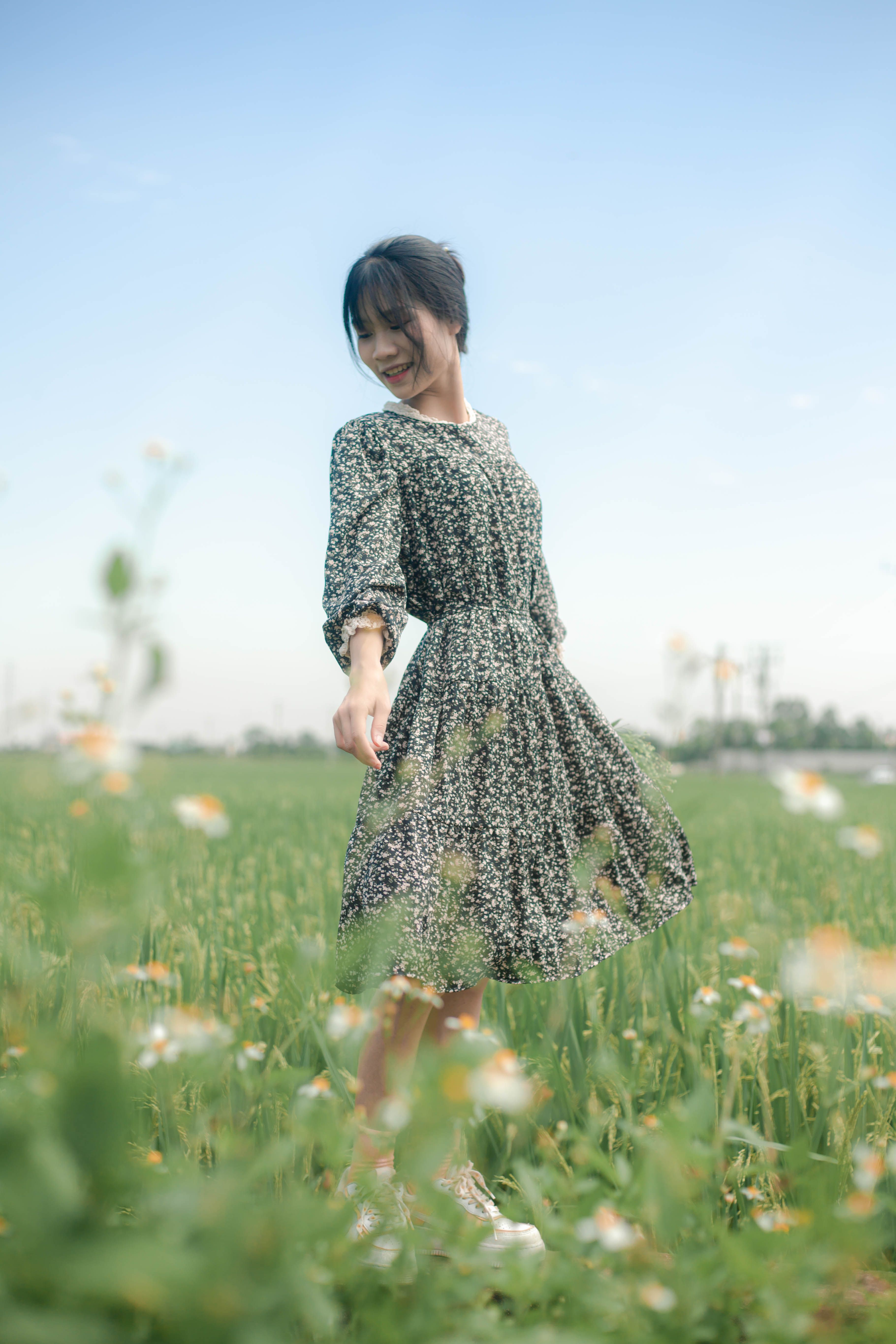 A Woman Standing in a Field of Flowers · Free Stock Photo