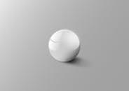 淡灰色背景上，优雅的白色球体反射出柔和光线，营造出极简主义的美感