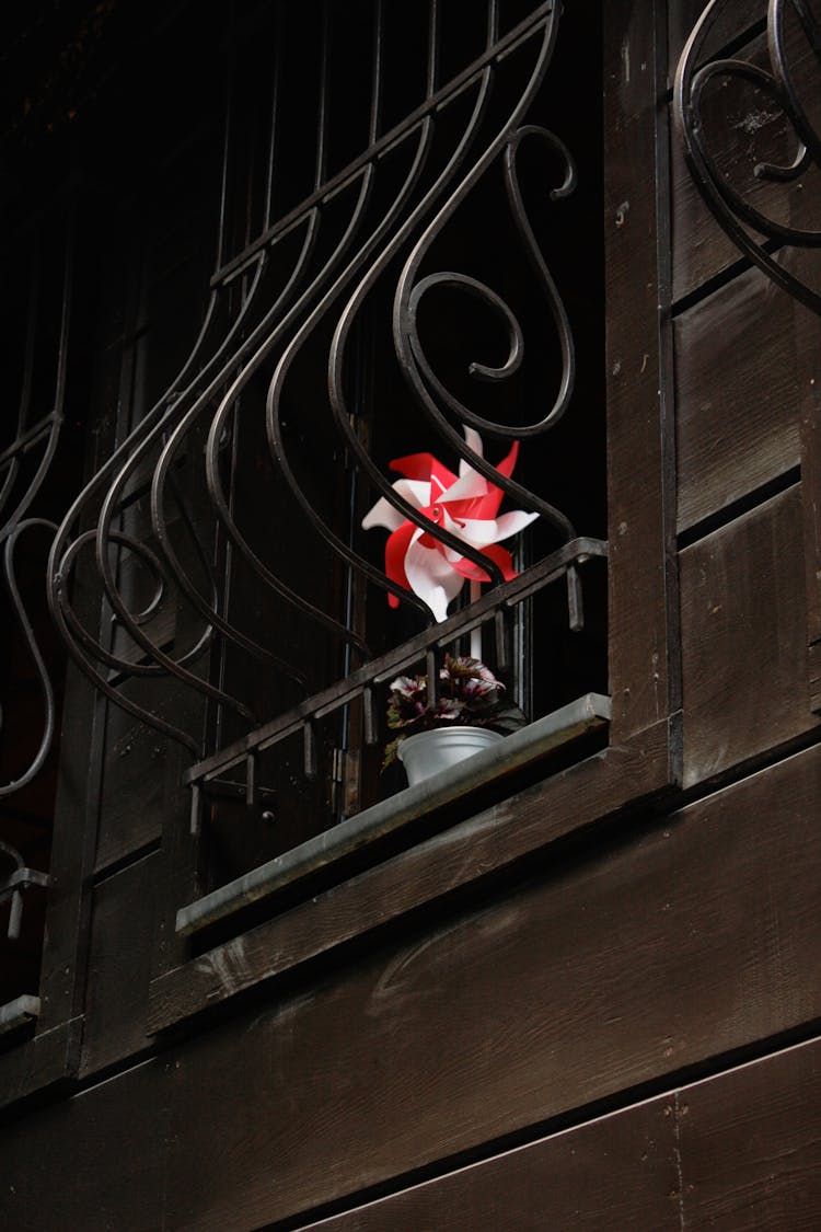 Close Up Of Balcony With Toy Fan