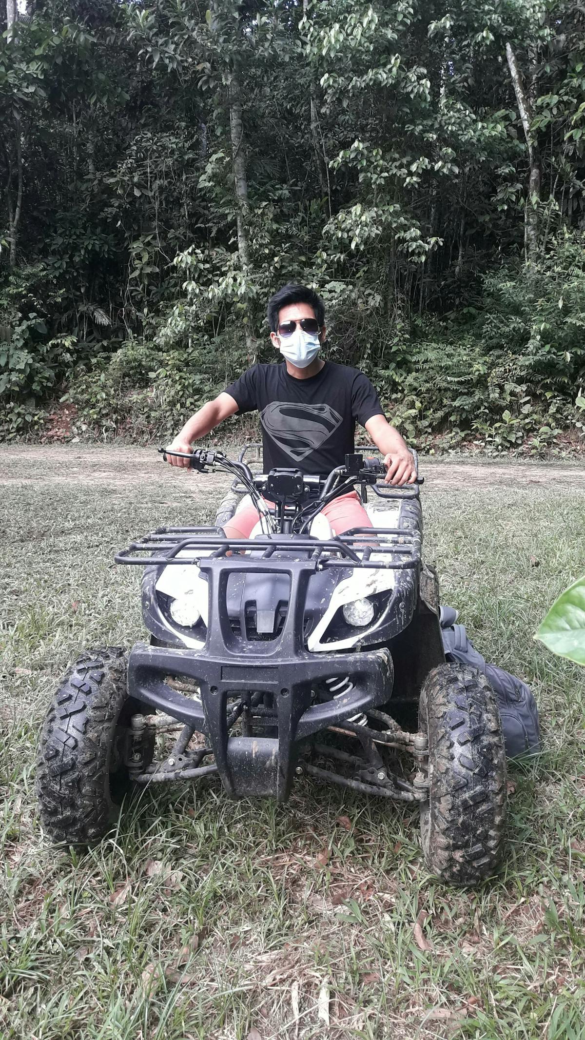 Person using a smartphone to browse music playlists at night