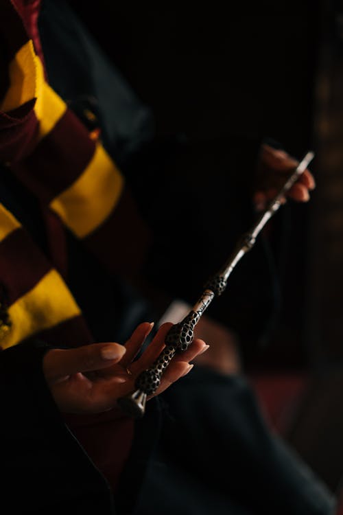 A Person Holding a Magic Wand