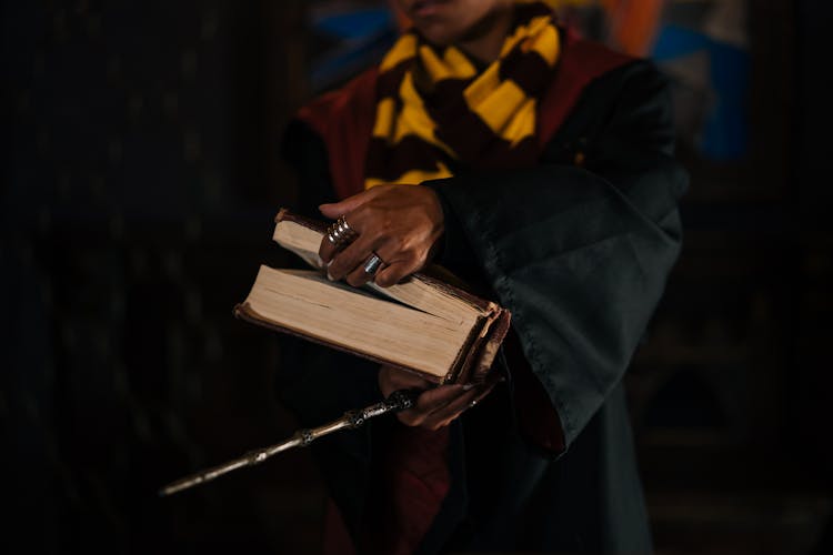 A Person Holding A Book