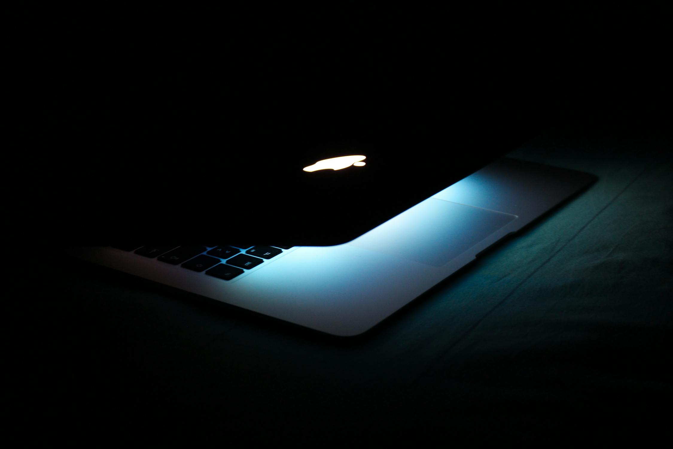 Photography of a Turned On Macbook · Free Stock Photo