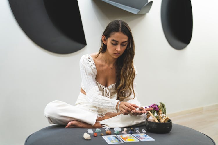 A Woman Looking The Healing Stones