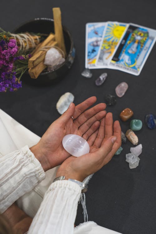 A Person Holding a White Stone