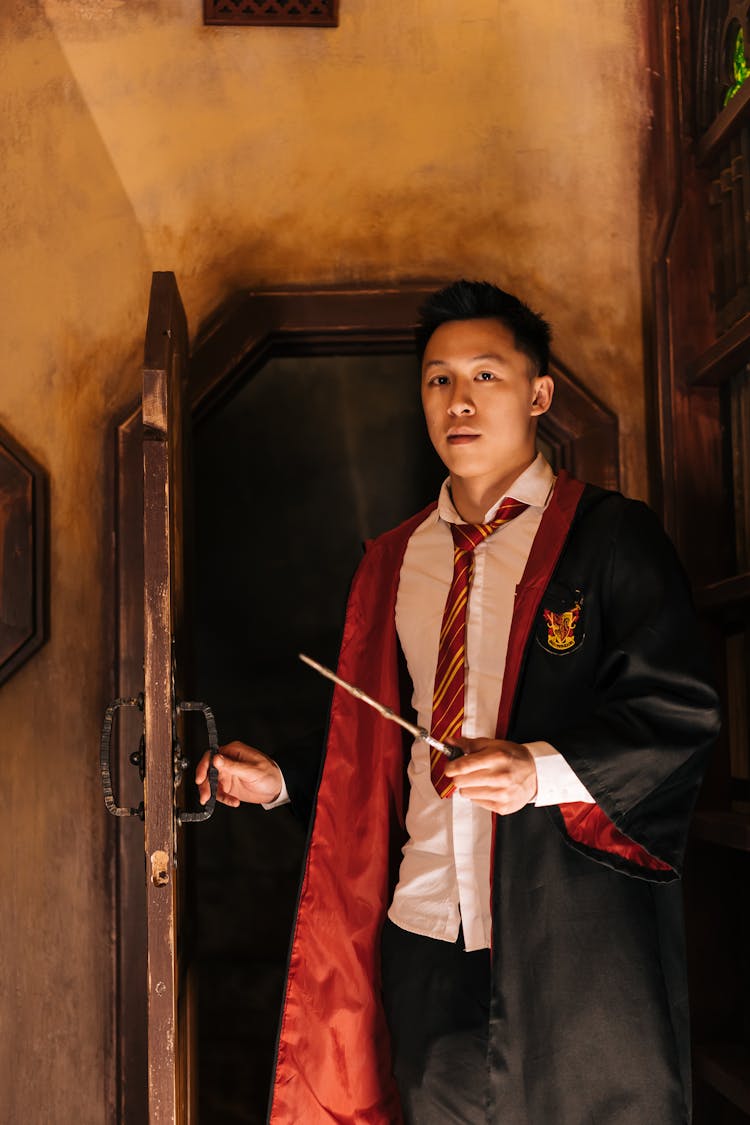 Man Wearing A Harry Potter Costume Standing At The Doorway