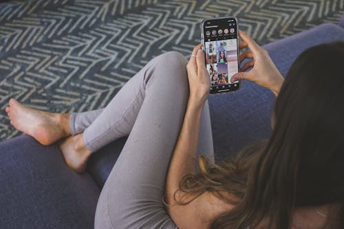 Woman on Sofa with Smartphone