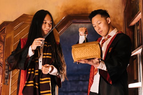 Woman and Man Throwing Spells on a Box