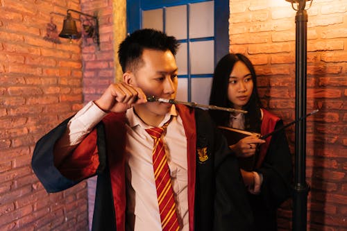 Wizard and Witch Pointing their Wands
