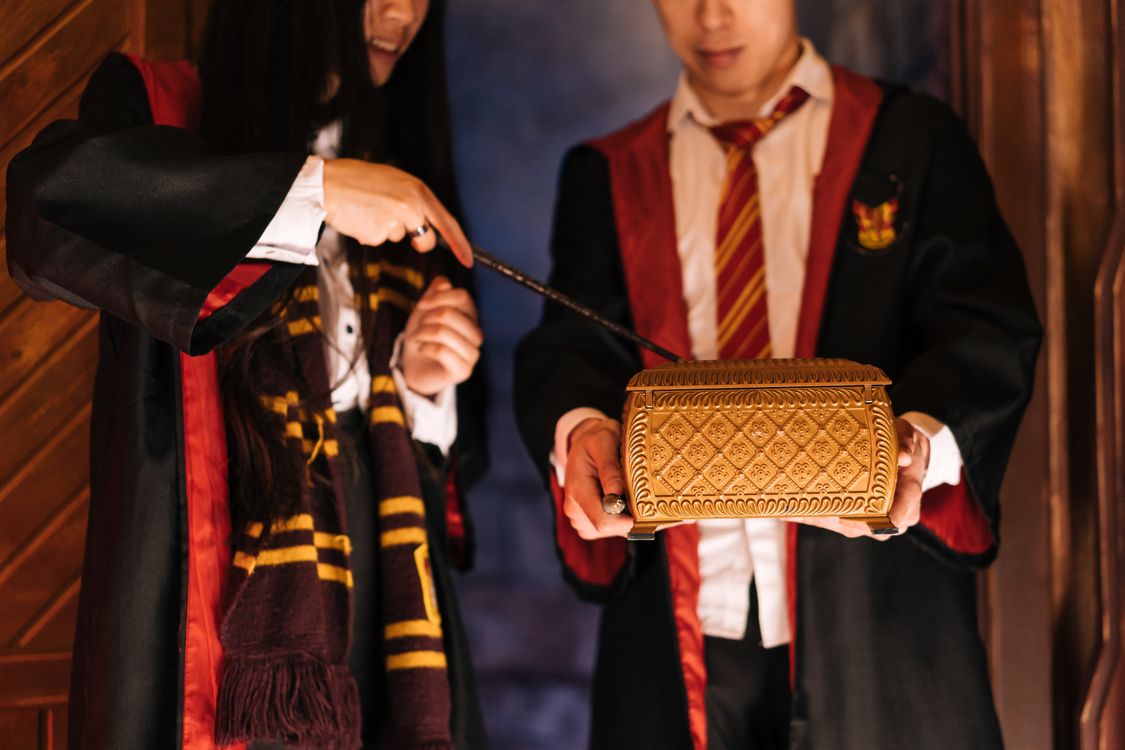 Wizard Opening a Box with a Magic Wand · Free Stock Photo