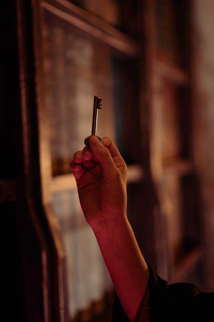 Person Holding A Key Photo