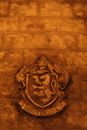 Brass Lion Door Knob on Brown Brick Wall