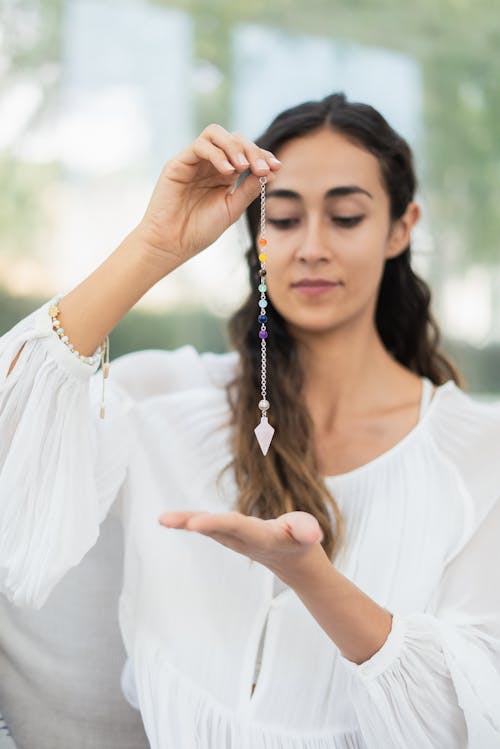 Woman Healing her Chakras with Healing Stones