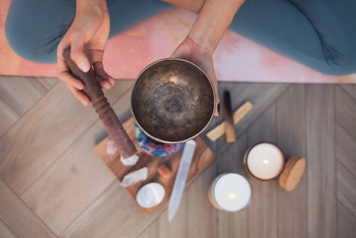 Overhead Shot of a Person Holding a Tibetan Singing Bowl