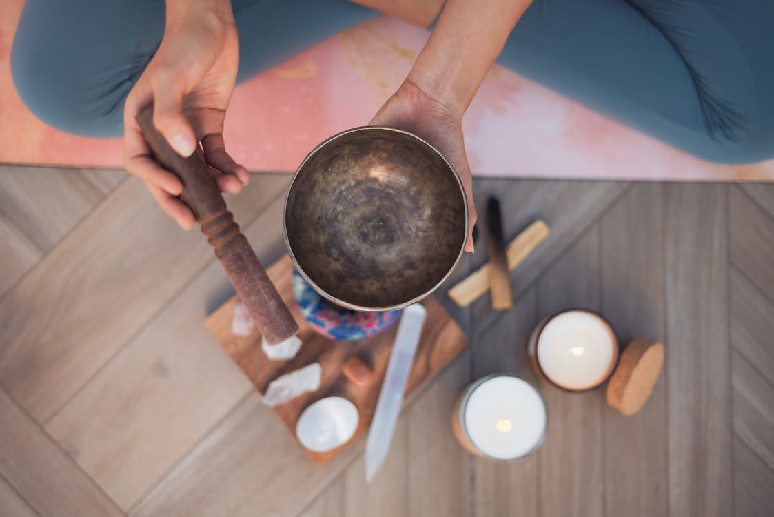 Free Overhead Shot of a Person Holding a Tibetan Singing Bowl Stock Photo