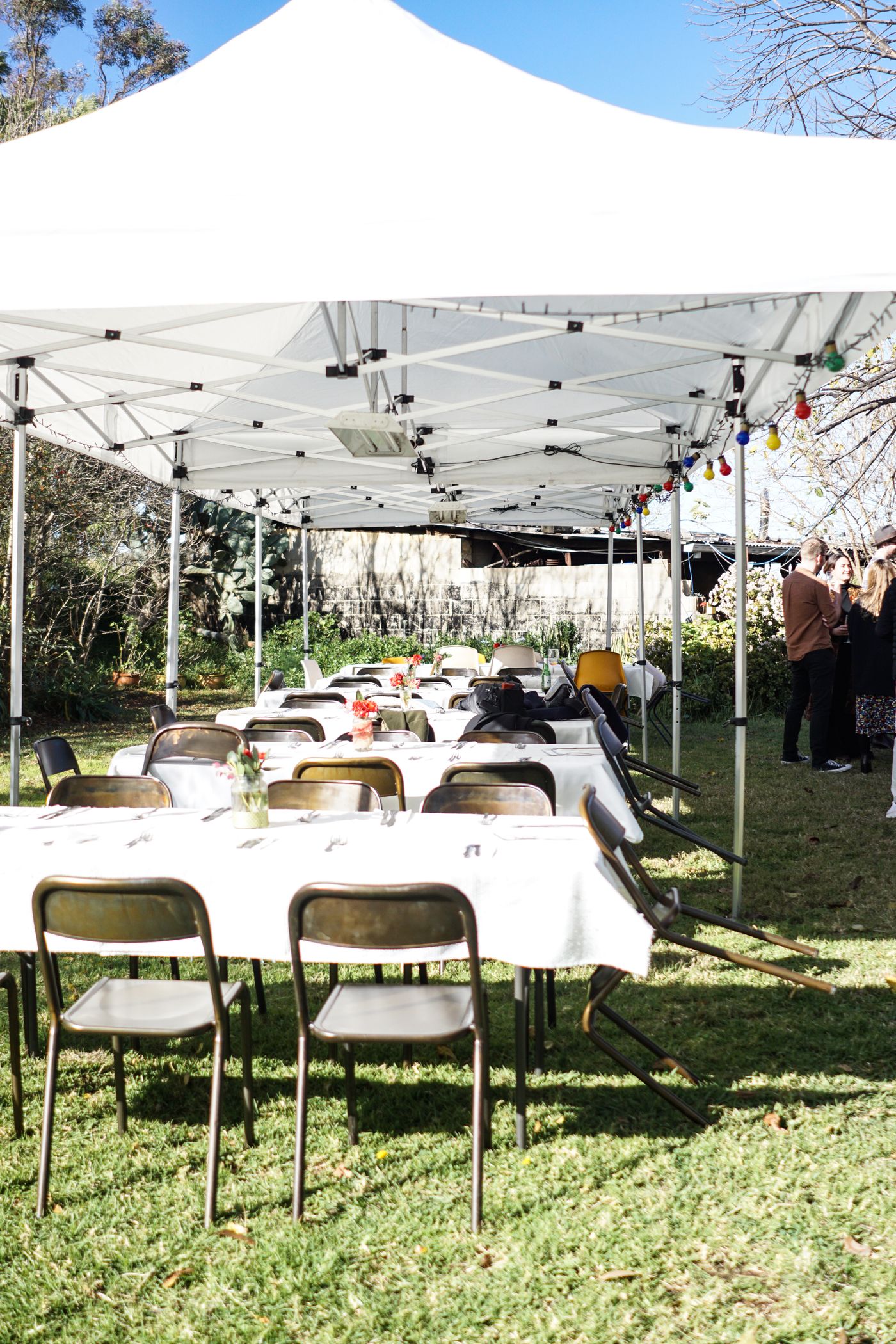 White commercial event tent with tables and chairs
